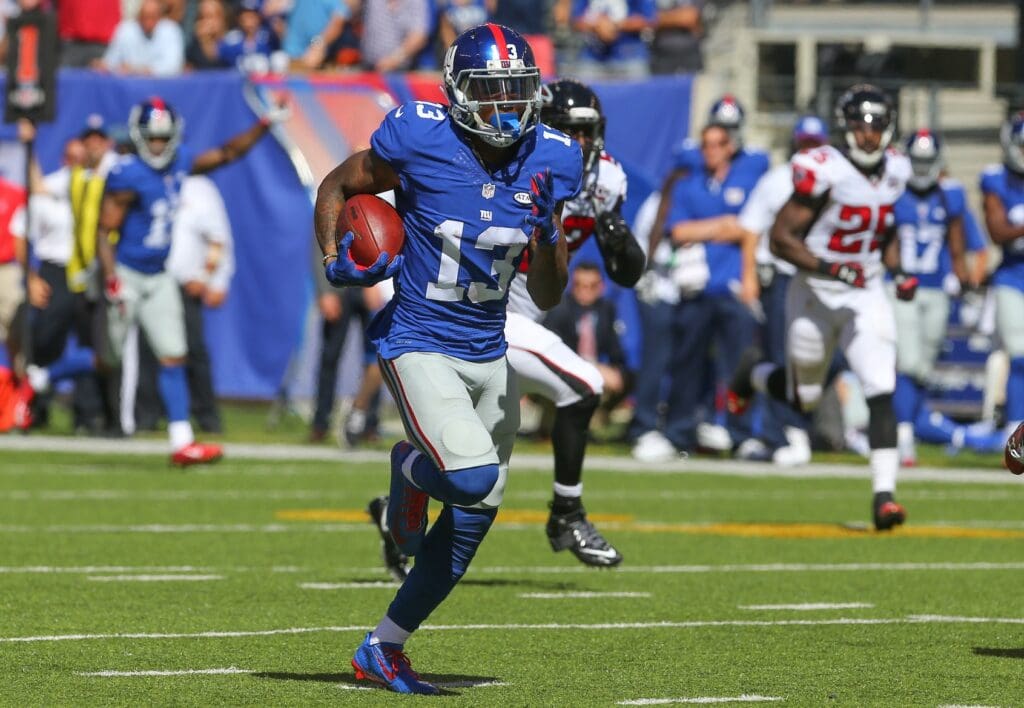 Sep 20, 2015; East Rutherford, NJ, USA; New York Giants wide receiver Odell Beckham Jr. (13) runs for a touchdown during the first half of their game against the Atlanta Falcons at MetLife Stadium.