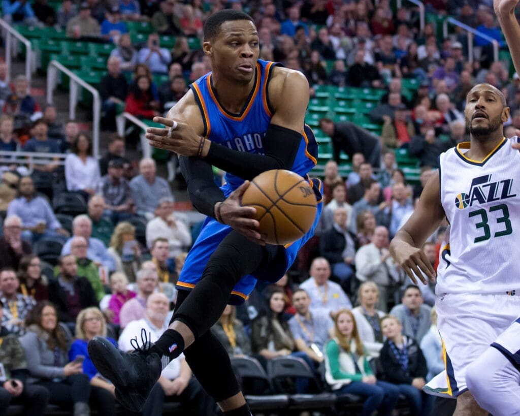 Dec 14, 2016; Salt Lake City, UT, USA; Oklahoma City Thunder guard Russell Westbrook (0) passes the ball from under the basket during the first quarter against the Utah Jazz at Vivint Smart Home Arena.