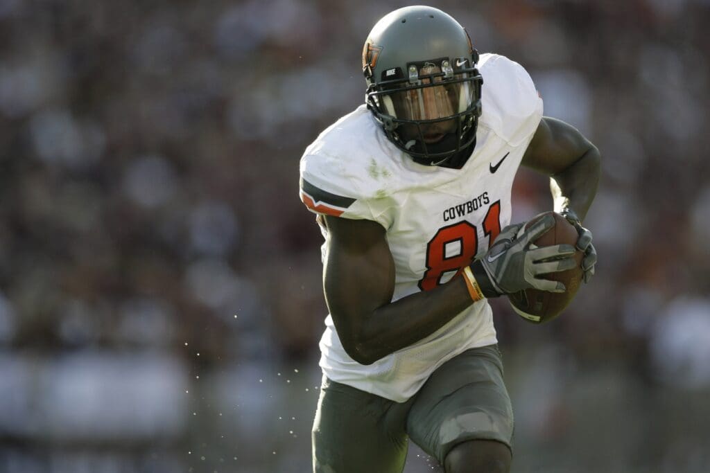 Sept 24, 2010; Houston, TX, USA; Oklahoma State Cowboys wide receiver Justin Blackmon (81) runs after a catch against the Texas A&M Aggies in the third quarter at Kyle Field. Oklahoma State defeated Texas A&M 30-29.