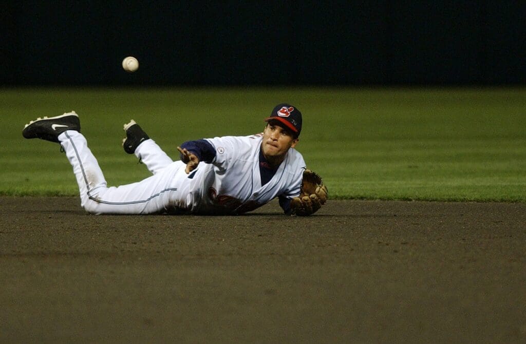 Aug 7, 2002; Cleveland, OH, USA; Cleveland Indians shortstop Omar Vizquel (13) tosses the ball to second base at Jacobs Field.