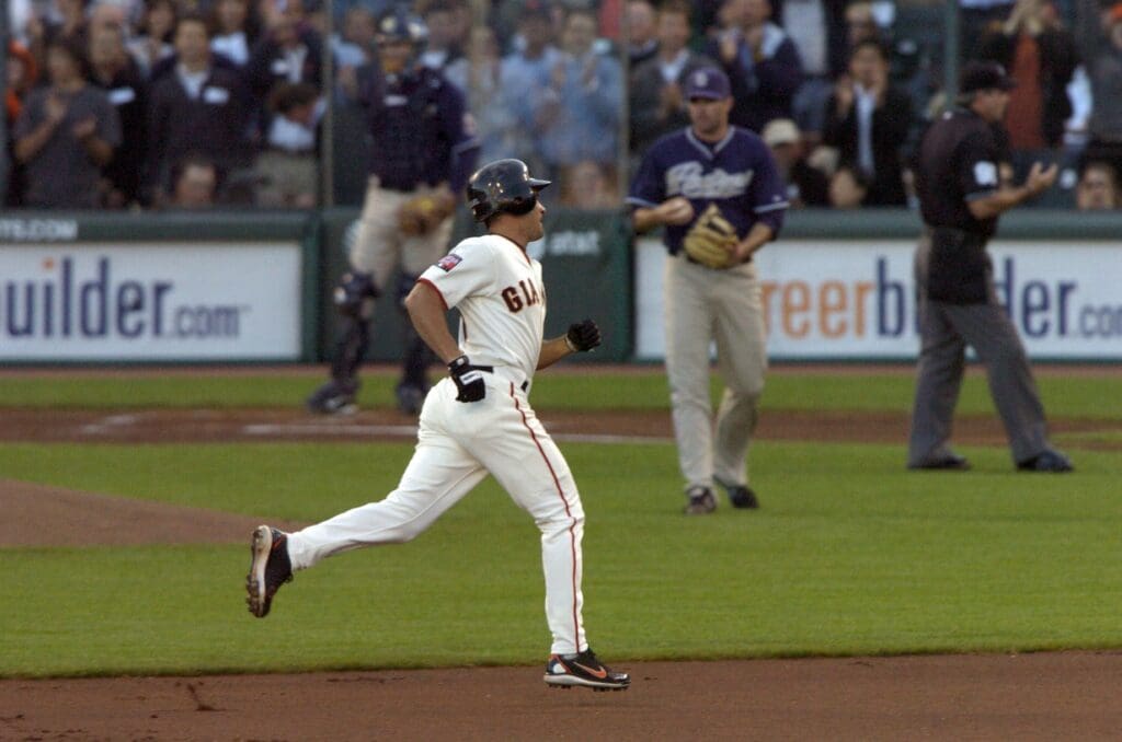 June 25, 2007; San Francisco, CA, USA; San Francisco Giants shortstop Omar Vizquel (front) rounds the bases after hitting a solo homerun off of San Diego Padres starting pitcher Justin Germano (second from right) during the 1st inning at AT&T Park in San Francisco, CA.