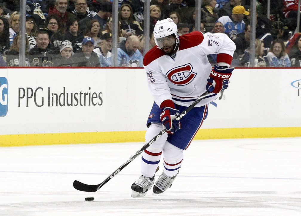 Jan 22, 2014; Pittsburgh, PA, USA; Montreal Canadiens defenseman P.K. Subban (76) carries the puck up ice against the Pittsburgh Penguins during the third period at the CONSOL Energy Center. The Penguins won 5-1.