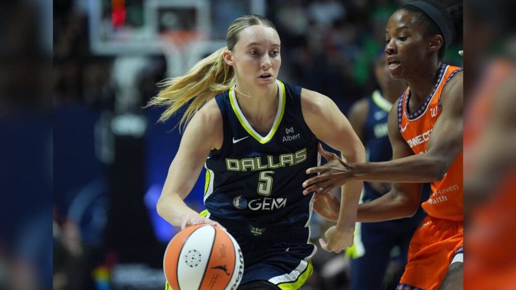 Jun 20, 2025; Uncasville, Connecticut, USA; Dallas Wings guard Paige Bueckers (5) drives the ball against Connecticut Sun guard Lindsay Allen (15) in the first half at Mohegan Sun Arena.