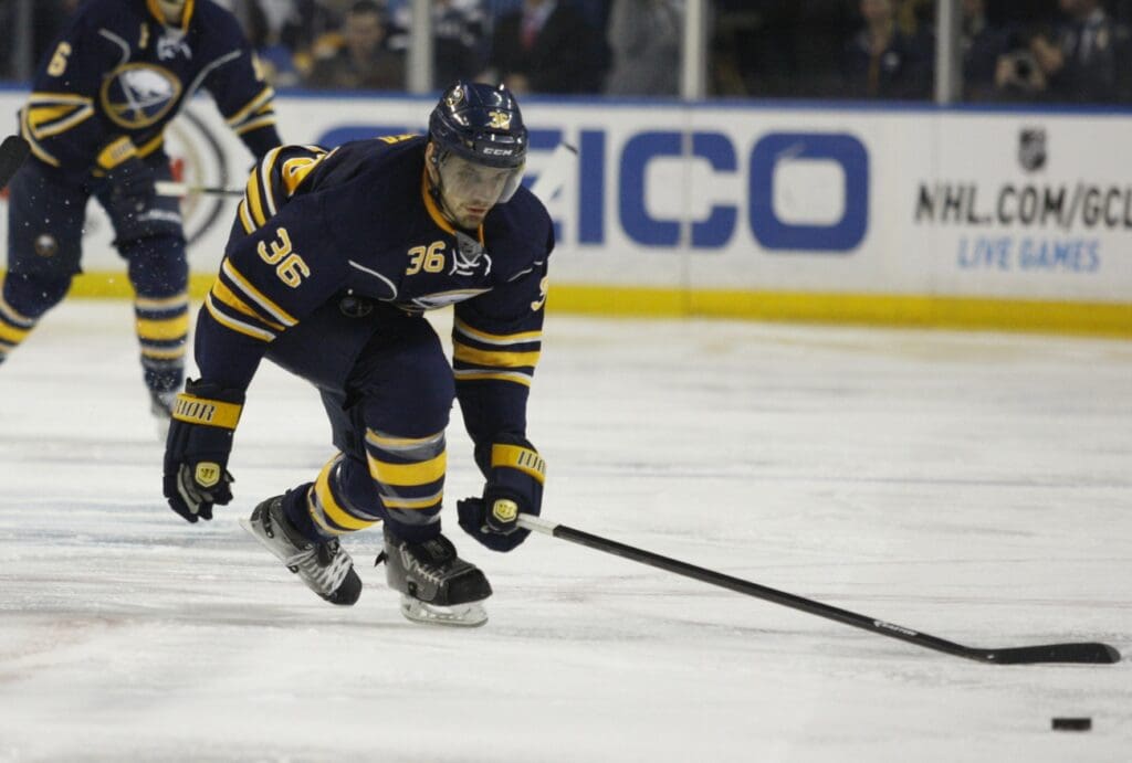 Jan 2, 2015; Buffalo, NY, USA; Buffalo Sabres right wing Patrick Kaleta (36) reaches for the loose puck during the second period against the Florida Panthers at First Niagara Center.