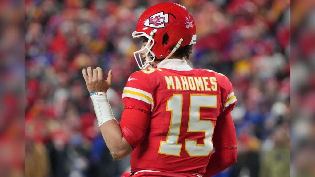 Jan 26, 2025; Kansas City, MO, USA; Kansas City Chiefs quarterback Patrick Mahomes (15) reacts after scoring a touchdown against the Buffalo Bills during the second half in the AFC Championship game at GEHA Field at Arrowhead Stadium.