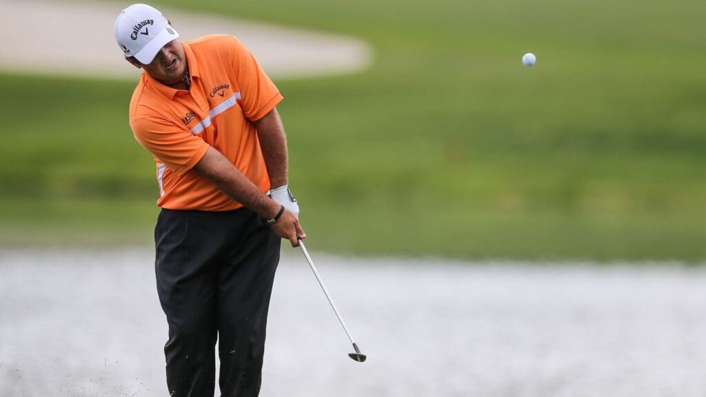 May 15, 2015; Charlotte, NC, USA; Patrick Reed pitches up on the 17th green during second round play at Quail Hollow Club.