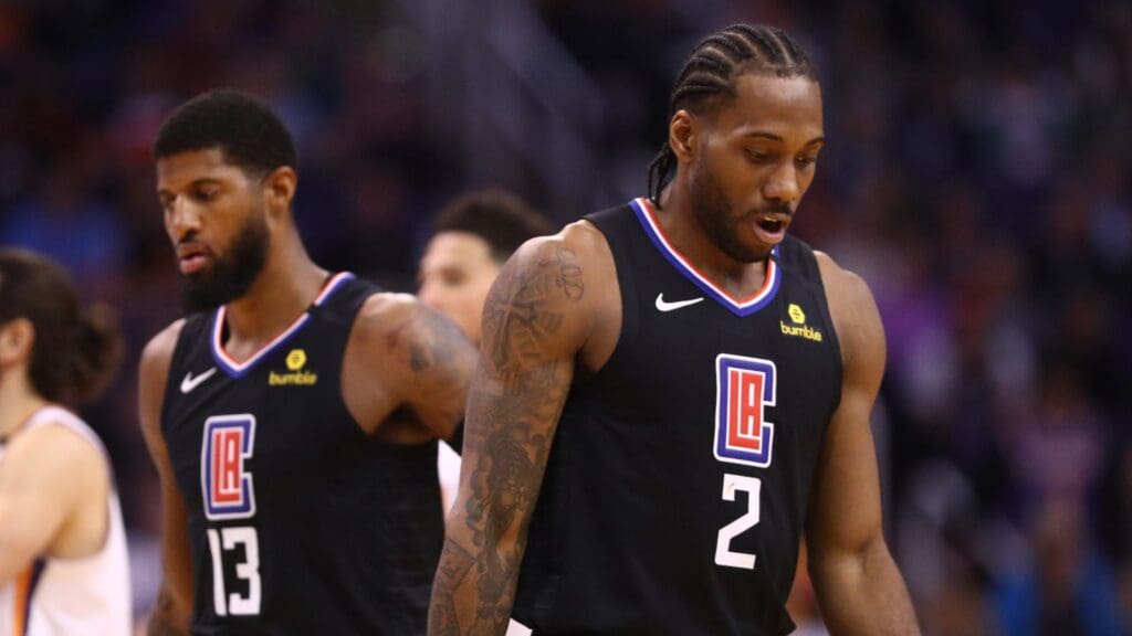 Feb 26, 2020; Phoenix, Arizona, USA; Los Angeles Clippers forward Kawhi Leonard (2) and guard Paul George (13) against the Phoenix Suns at Talking Stick Resort Arena.