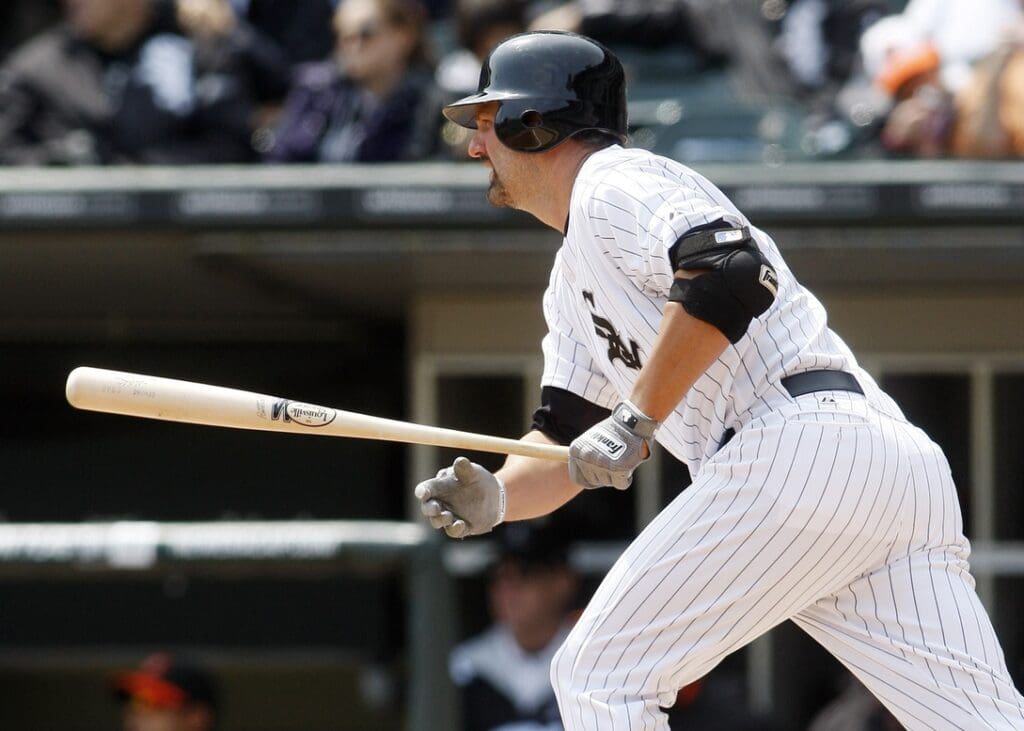 Apr 19, 2012; Chicago, IL, USA; Chicago White Sox first baseman Paul Konerko hits a single during the first inning against the Baltimore Orioles at US Cellular Field.