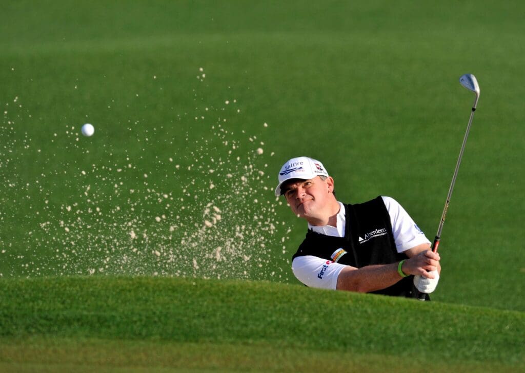 Apr 9, 2013; Augusta, GA, USA; Paul Lawrie hits out of a bunker onto the 2nd green during a practice round for the 2013 The Masters golf tournament at Augusta National Golf Club.