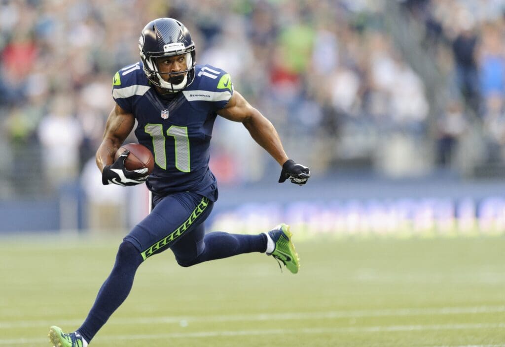 Aug 22, 2014; Seattle, WA, USA; Seattle Seahawks wide receiver Percy Harvin (11) carries the ball after catching a pass during the first half against the Chicago Bears at CenturyLink Field