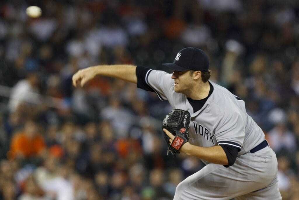 Oct 4, 2011; Detroit, MI, USA; New York Yankees starting pitcher Phil Hughes (65) pitches during game four of the 2011 ALDS against the Detroit Tigers at Comerica Park.