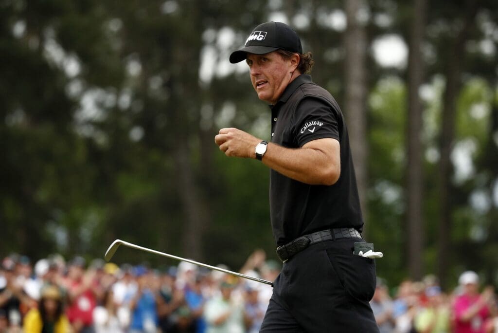 Phil Mickelson reacts after completing the final round of The Masters golf tournament at Augusta National Golf Club.