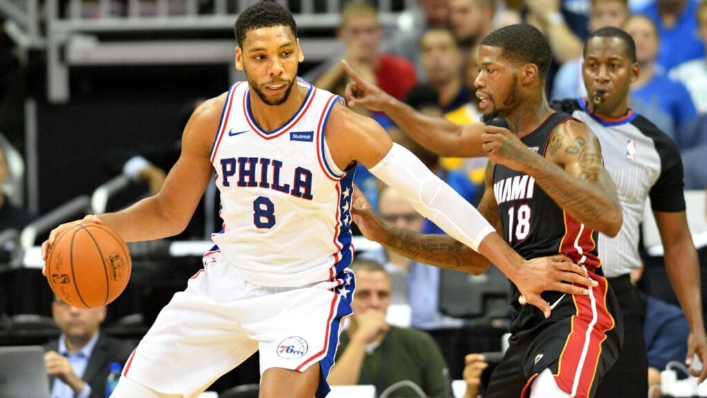 Oct 13, 2017; Kansas City, MO, USA; Philadelphia 76ers center Jahlil Okafor (8) dribbles the ball as Miami Heat guard DeAndre Liggins (18) defends during the second half at Sprint Center.