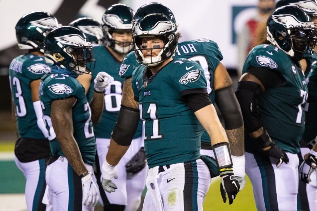 Nov 30, 2020; Philadelphia, Pennsylvania, USA; Philadelphia Eagles quarterback Carson Wentz (11) looks back from the huddle during the first quarter against the Seattle Seahawks at Lincoln Financial Field