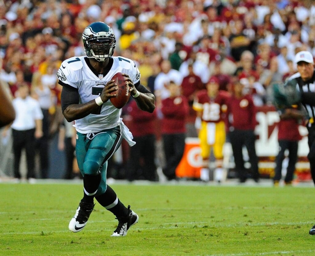 Sep 9, 2013; Landover, MD, USA; Philadelphia Eagles quarterback Michael Vick (7) rolls out during the first half against the Washington Redskins at FedEX Field.