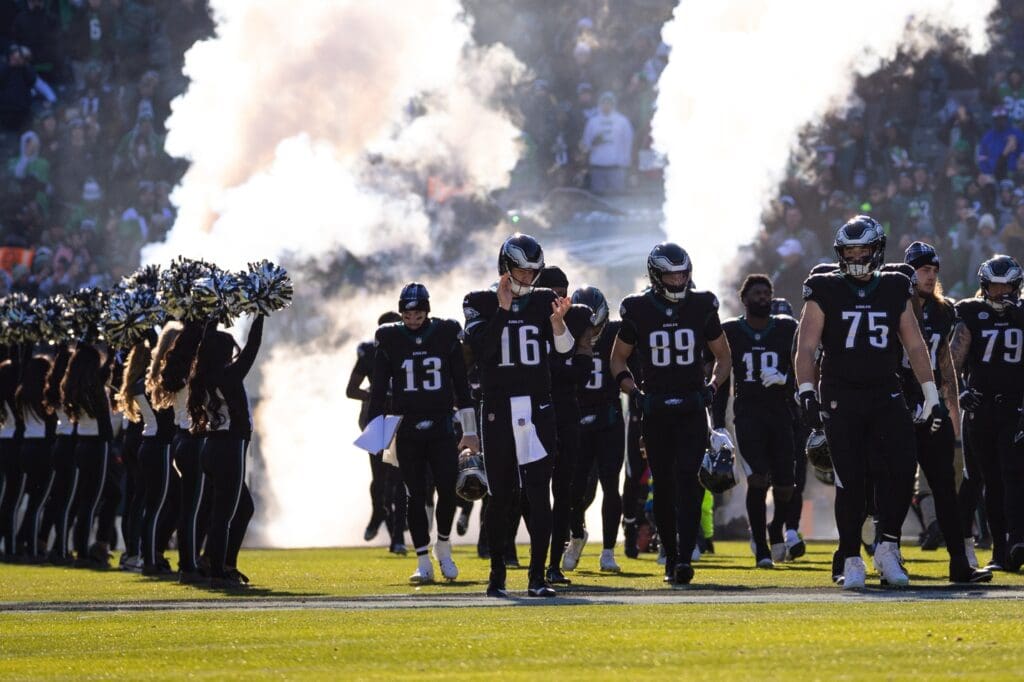 Jan 5, 2025; Philadelphia, Pennsylvania, USA; Philadelphia Eagles quarterback Tanner McKee (16) leads his team onto the field for action against the New York Giants at Lincoln Financial Field.