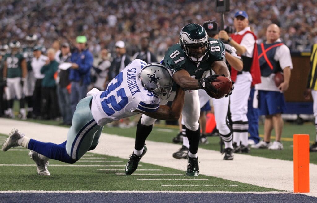 Dec 24, 2011; Dallas, TX, USA; Philadelphia Eagles receiver Jason Avant (81) dives for the pylon while losing the ball against Dallas Cowboys cornerback Orlando Scandrick (32) in the second quarter at Cowboys Stadium.