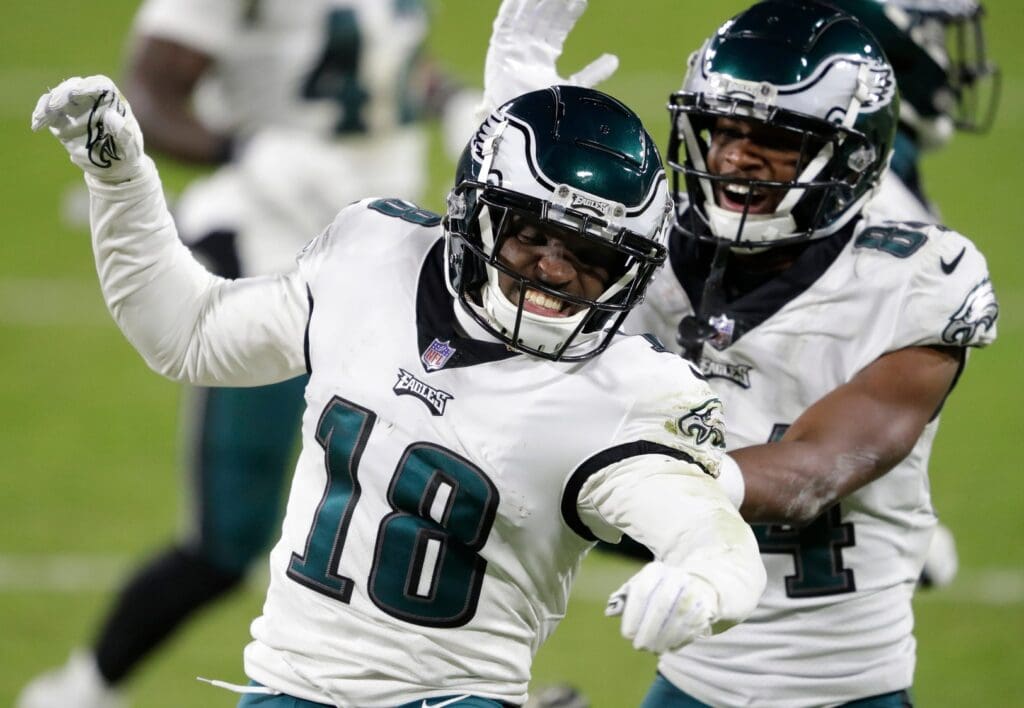 Philadelphia Eagles wide receiver Jalen Reagor (18) celebrates running back a punt return for a touchdown with wide receiver Greg Ward (84) against the Green Bay Packers in the fourth quarter during their football game Sunday, December 6, 2020, at Lambeau Field in Green Bay, Wis