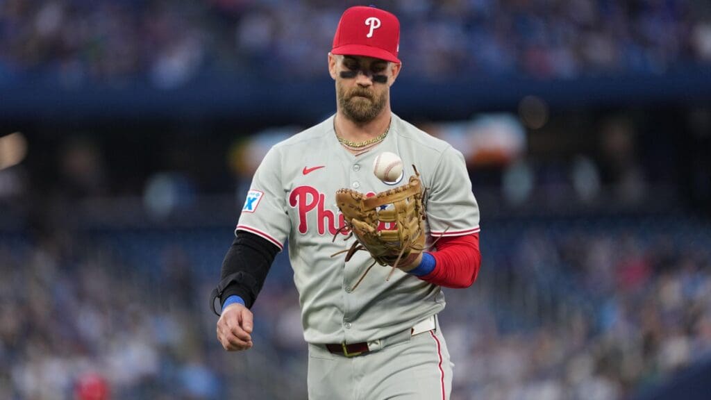 Jun 3, 2025; Toronto, Ontario, CAN; Philadelphia Phillies first baseman Bryce Harper (3) walks towards the dugout after the third out against the Toronto Blue Jays during the fourth inning at Rogers Centre.