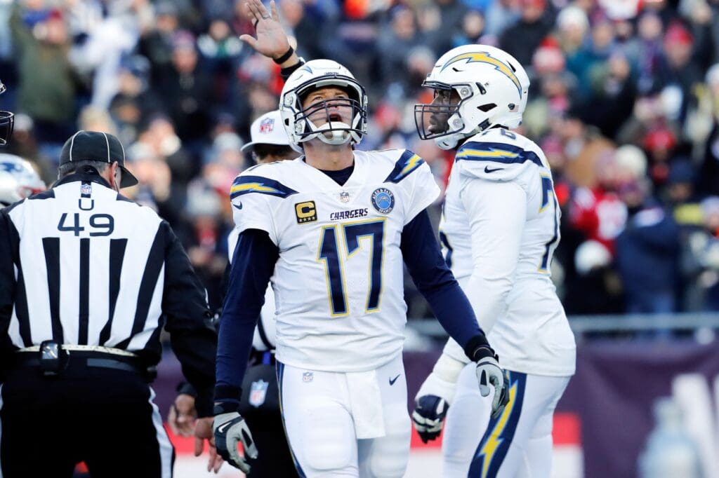 Jan 13, 2019; Foxborough, MA, USA; Los Angeles Chargers quarterback Philip Rivers (17) reacts after being sacked by the New England Patriots during the second quarter in an AFC Divisional playoff football game at Gillette Stadium