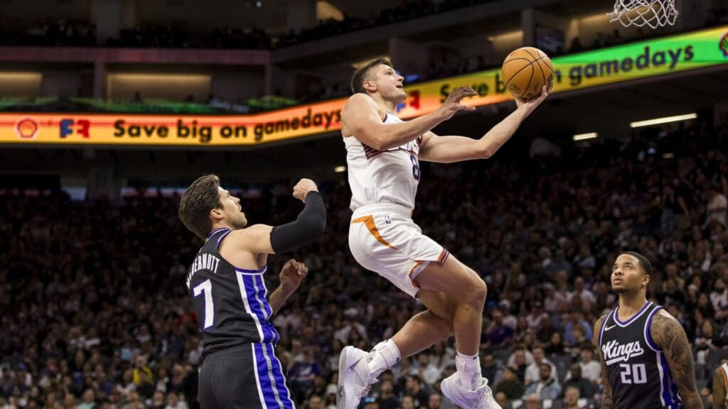 Apr 13, 2025; Sacramento, California, USA; Phoenix Suns guard Grayson Allen (8) lays up the ball against the Sacramento Kings during the fourth quarter at Golden 1 Center.