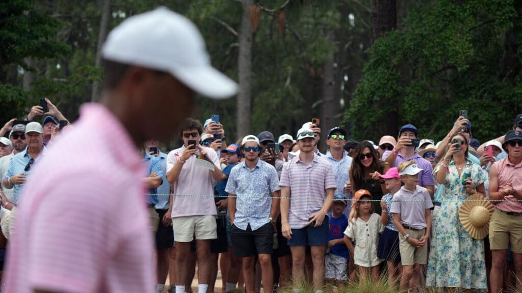 Jun 13, 2024; Pinehurst, North Carolina, USA; Fans on the eighth fairway watch Tiger Woods during the first round of the U.S. Open golf tournament.