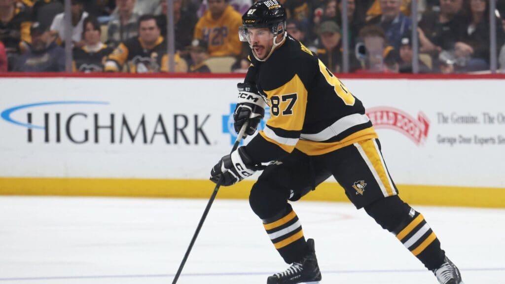Apr 13, 2025; Pittsburgh, Pennsylvania, USA; Pittsburgh Penguins center Sidney Crosby (87) handles the puck against the Boston Bruins during the third period at PPG Paints Arena.