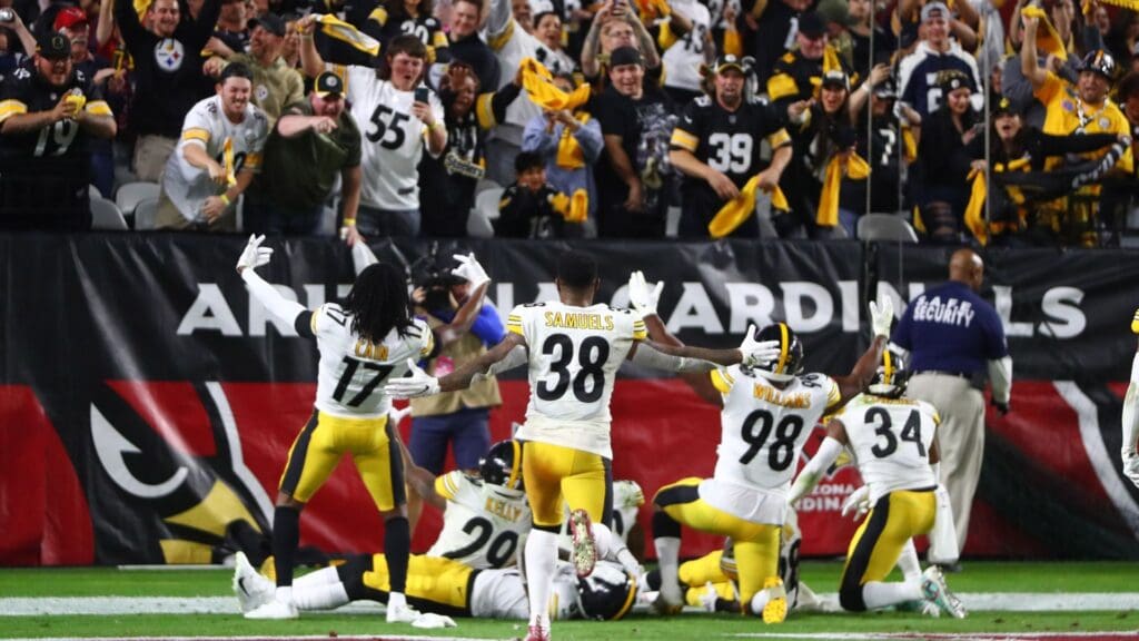 Dec 8, 2019; Glendale, AZ, USA; Pittsburgh Steelers players celebrate together as a team in front of fans waving yellow terrible towels after scoring against the Arizona Cardinals at State Farm Stadium.