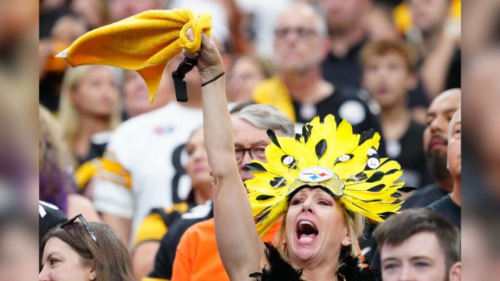 Oct 13, 2024; Paradise, Nevada, USA; A Pittsburgh Steelers fan cheers during a game between the Steelers and the Las Vegas Raiders during the first quarter at Allegiant Stadium.