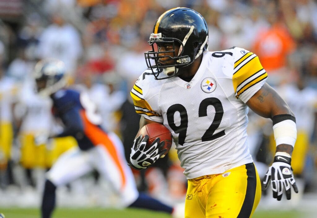 Aug 29, 2010; Denver, CO, USA; Pittsburgh Steelers linebacker James Harrison (92) runs back a tipped pass in the second quarter against the Denver Broncos at Invesco Field.