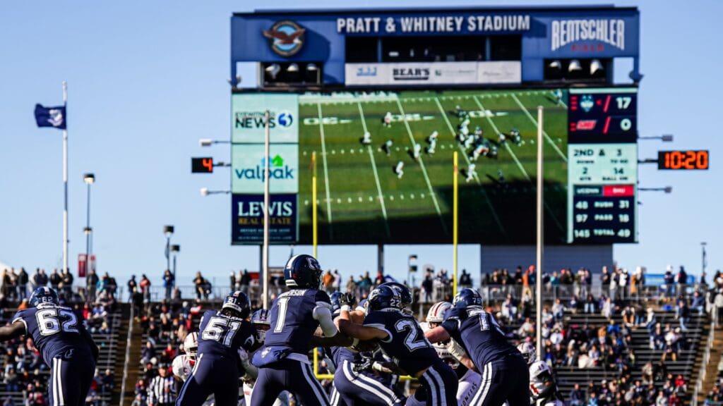 Nov 18, 2023; East Hartford, Connecticut, USA; UConn Huskies quarterback Ta'Quan Roberson (1) hands off the ball to running back Victor Rosa (22) against the Sacred Heart Pioneers in the second quarter at Rentschler Field at Pratt & Whitney Stadium