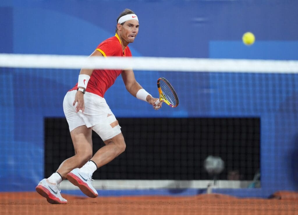 Jul 27, 2024; Paris, France; Rafael Nadal (ESP) in action during a men's tennis doubles match during the Paris 2024 Olympic Summer Games at Stade Roland Garros.