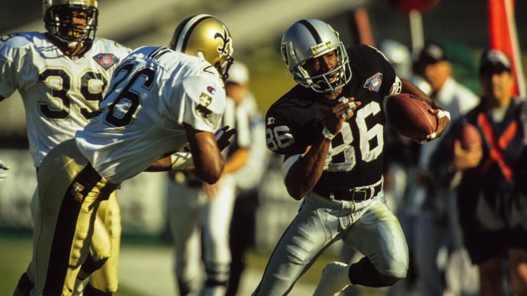 Nov 20, 1994; Los Angeles, CA, USA: FILE PHOTO; Los Angeles Raiders receiver Raghib Ismail (86) in action against New Orleans Saints safety Vince Buck (26) at Los Angeles Memorial Coliseum.