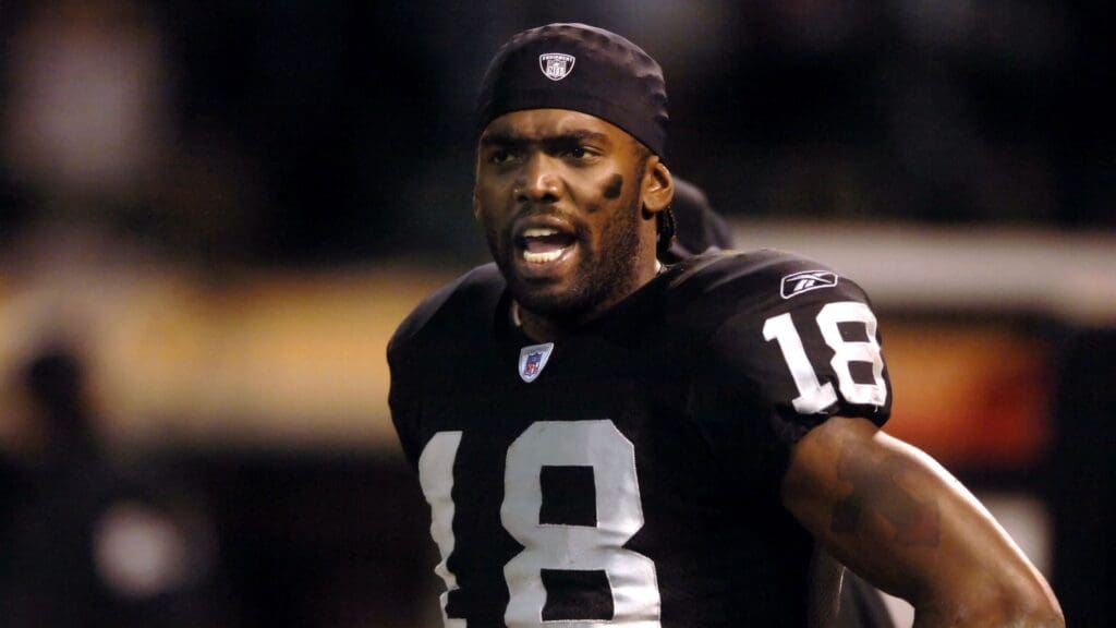 Dec. 31, 2005; Oakland, Calif, USA; Oakland Raiders wide receiver (18) Randy Moss expresses his displeasure with head coach Norv Turner (not pictured) during their game against the New York Giants in the fourth quarter at McAfee Coliseum.