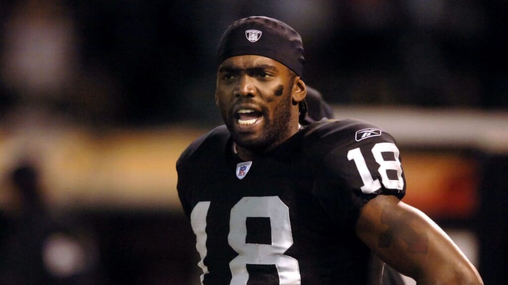 Dec. 31, 2005; Oakland, Calif, USA; Oakland Raiders wide receiver (18) Randy Moss expresses his displeasure with head coach Norv Turner (not pictured) during their game against the New York Giants in the fourth quarter at McAfee Coliseum.