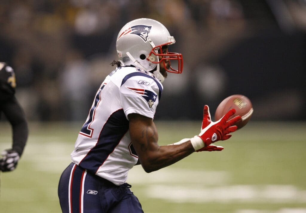 Nov. 30 2009; New Orleans, LA, USA; New England Patriots wide receiver Randy Moss (81) catches a pass against the New Orleans Saints in the third quarter at the Louisiana Superdome