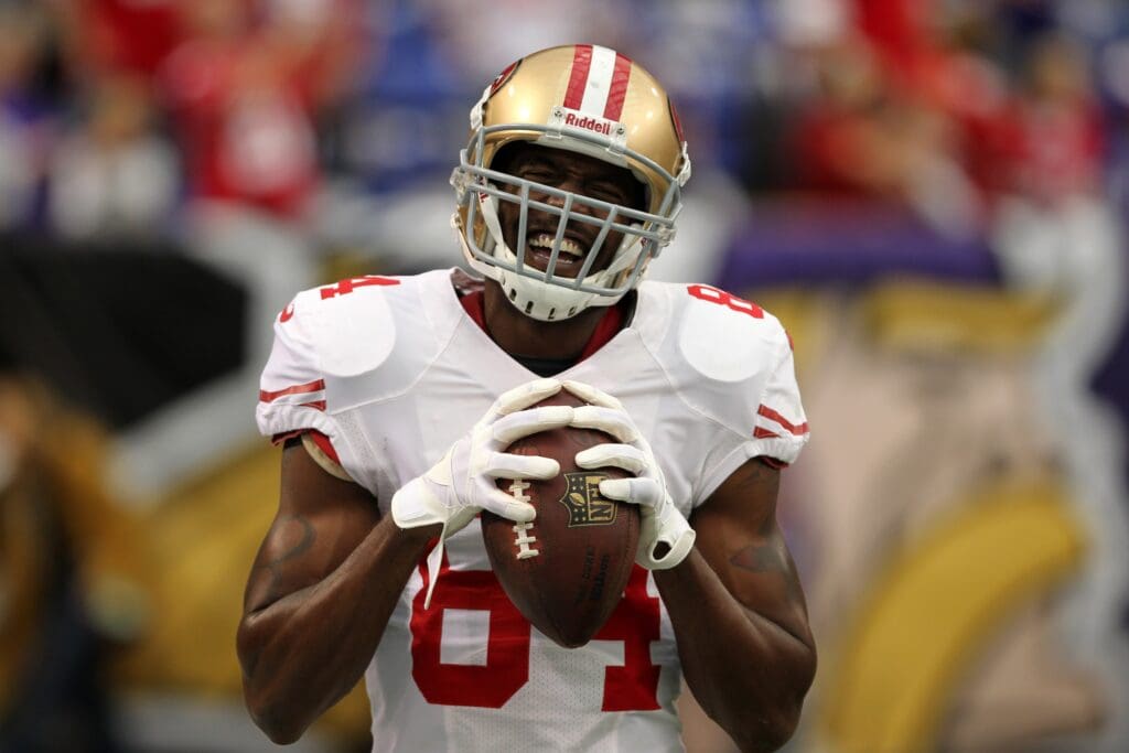 Sep 23, 2012; Minneapolis, MN, USA; San Francisco 49ers wide receiver Randy Moss (84) laughs prior to the game against the Minnesota Vikings at the Metrodome