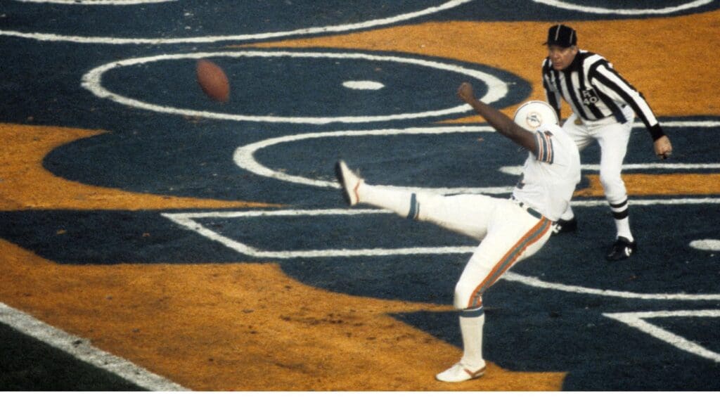 Jan 20, 1985; Stanford, CA, USA; FILE PHOTO; Miami Dolphins punter Reggie Roby (4) punts the ball against the San Francisco 49ers during Super Bowl XIX at Stanford Stadium. The 49ers defeated the Dolphins 38-16.