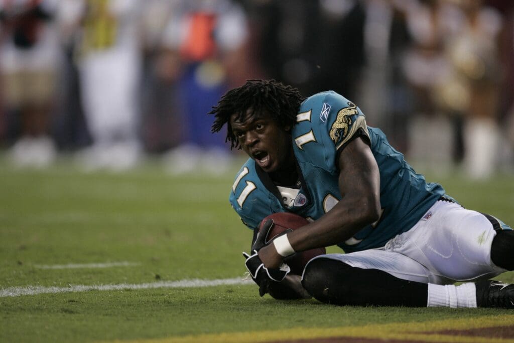 Oct 1, 2006; Landover, MD, USA; Jacksonville Jaguars wide receiver (11) Reggie Williams reacts after having his helmet knocked off while scoring a touchdown in the fourth quarter at FedEx Field in Landover, MD.