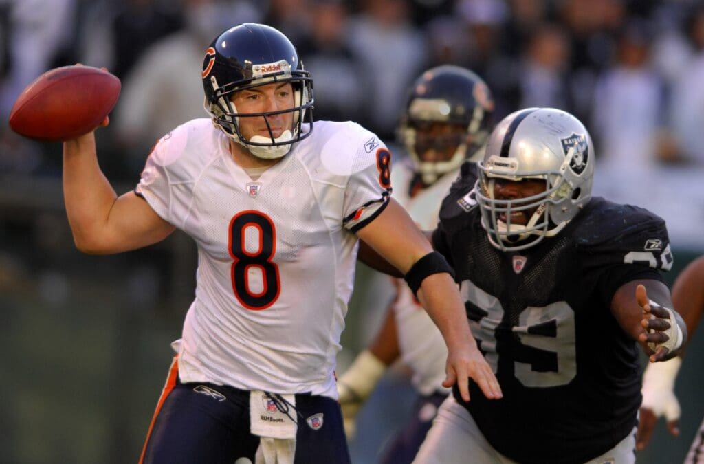 Nov 11, 2007; Oakland, CA, USA; Chicago Bears quarterback Rex Grossman (8) is pressured by Oakland Raiders defensive tackle Warren Sapp (99) in the fourth quarter at McAfee Coliseum. The Bears defeated the Raiders, 17-6
