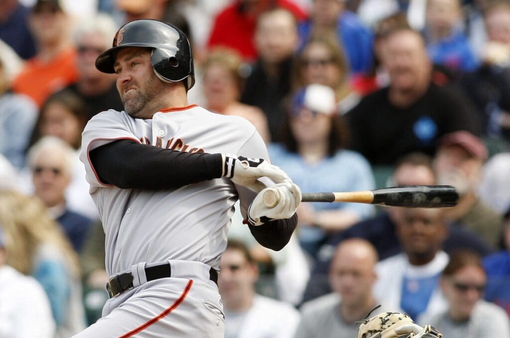 May 5, 2009; Chicago, IL, USA; San Francisco Giants first baseman Rich Aurilia (35) hits a single during the eighth inning against the Chicago Cubs at Wrigley Field.