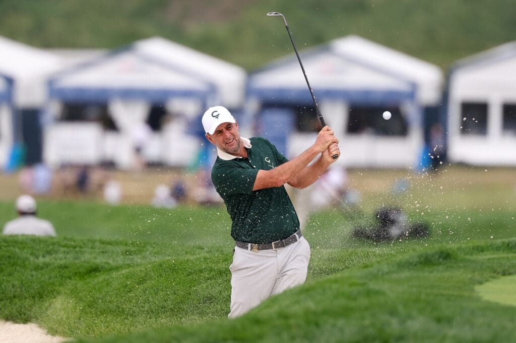 Jun 9, 2025; Oakmont, Pennsylvania, USA; Richard Bland plays a shot from a bunker on the 11th hole during a practice round for the U.S. Open golf tournament at Oakmont Country Club.