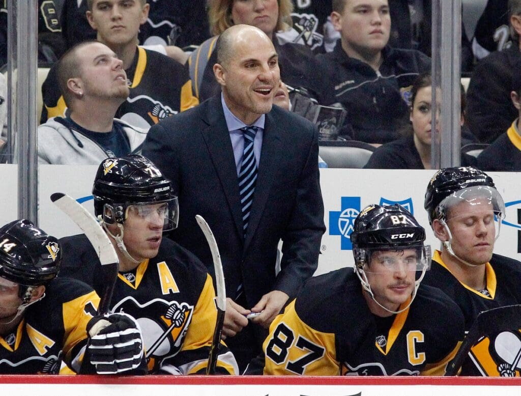 Nov 17, 2015; Pittsburgh, PA, USA; Pittsburgh Penguins assistant coach Rick Tocchet (center) reacts on the bench against the Minnesota Wild during the first period at the CONSOL Energy Center. The Penguins won 4-3.
