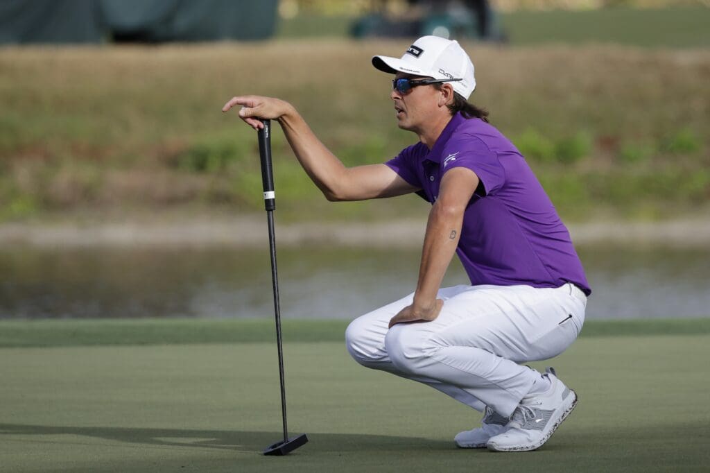 Dec 14, 2024; Naples, Florida, USA; Rickie Fowler lines up a putt on the 18th green during the second round of the Grant Thornton Invitational at Tiburon Golf Club