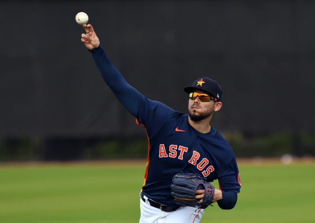 Feb 13, 2020; West Palm Beach, Florida, USA; Houston Astros pitcher Roberto Osuna (54) warms-up before the morning spring training workout.