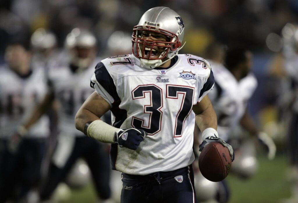 Feb 06, 2005; Jacksonville, FL, USA; New England safety Rodney Harrison (37) celebrates his late-game interception that sealed the Patriots 24-21 win over the Philadelphia Eagles in Super Bowl XXXIX at Alltel Stadium