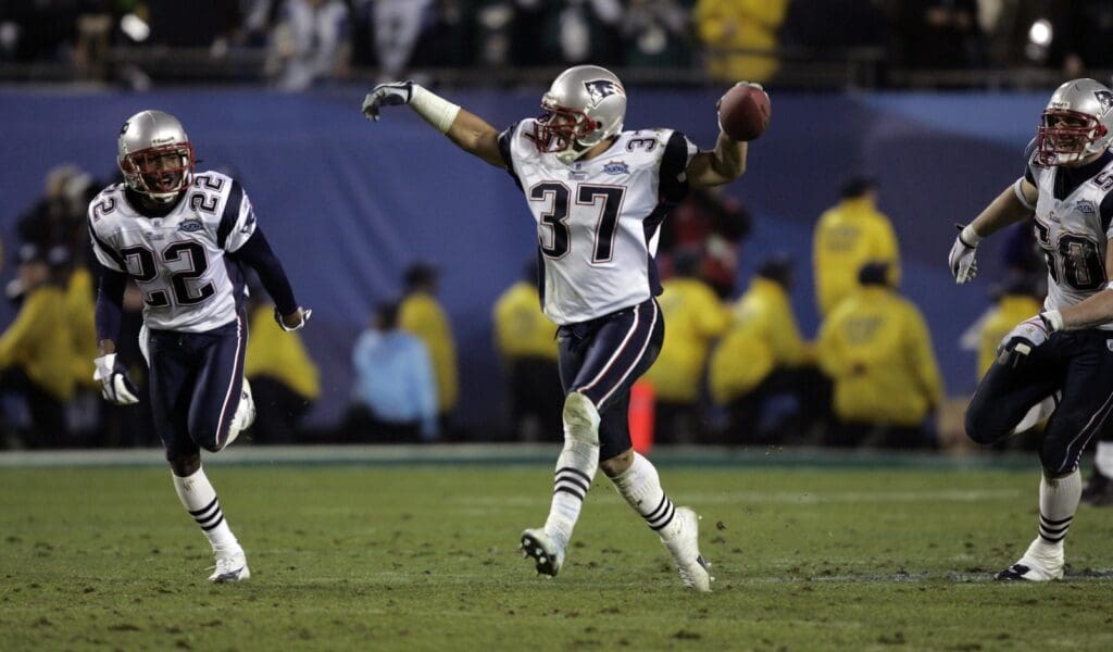 Feb 06, 2005; Jacksonville, FL, USA; New England safety Rodney Harrison (37) celebrates his late-game interception that sealed the Patriots 24-21 win over the Philadelphia Eagles in Super Bowl XXXIX at Alltel Stadium.