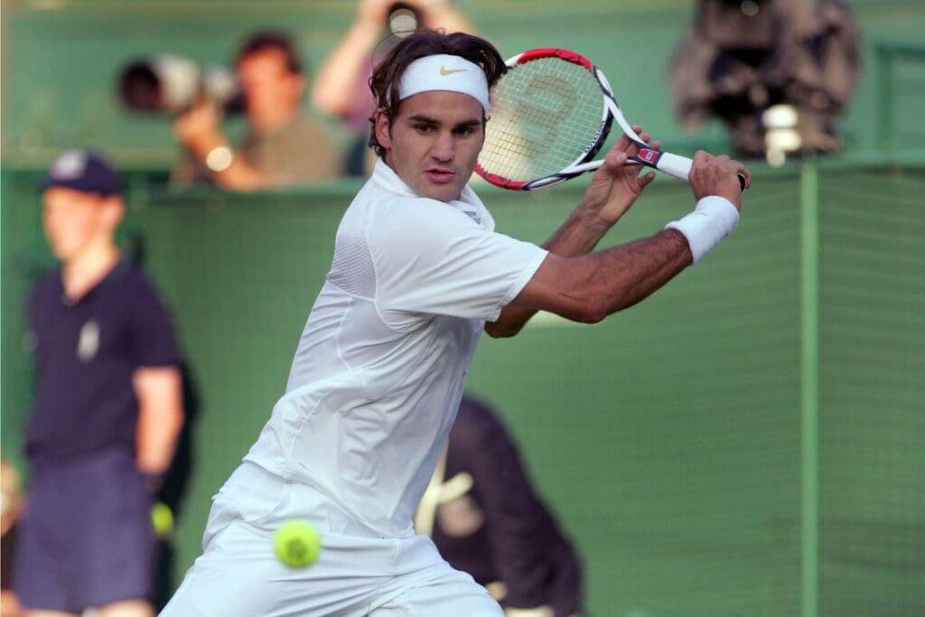 Jun 29, 2007; London, ENGLAND; Roger Federer (SUI) in action during his third round match against Marat Safin (not pictured) during the 2007 Wimbledon Championships at the All England Tennis Club. Federer defeated Safin in straight sets, 6-1, 6-4, 7-6.