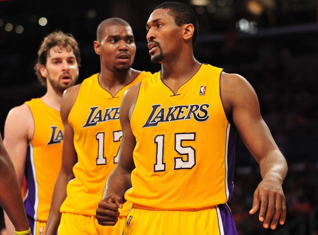 April 20, 2011; Los Angeles, CA, USA; Los Angeles Lakers small forward Ron Artest (15) reacts with center Andrew Bynum (17) and power forward Pau Gasol (16) after blocking a shot against the New Orleans Hornets in the first half of game two of the first round of the 2011 NBA playoffs at the Staples Center.