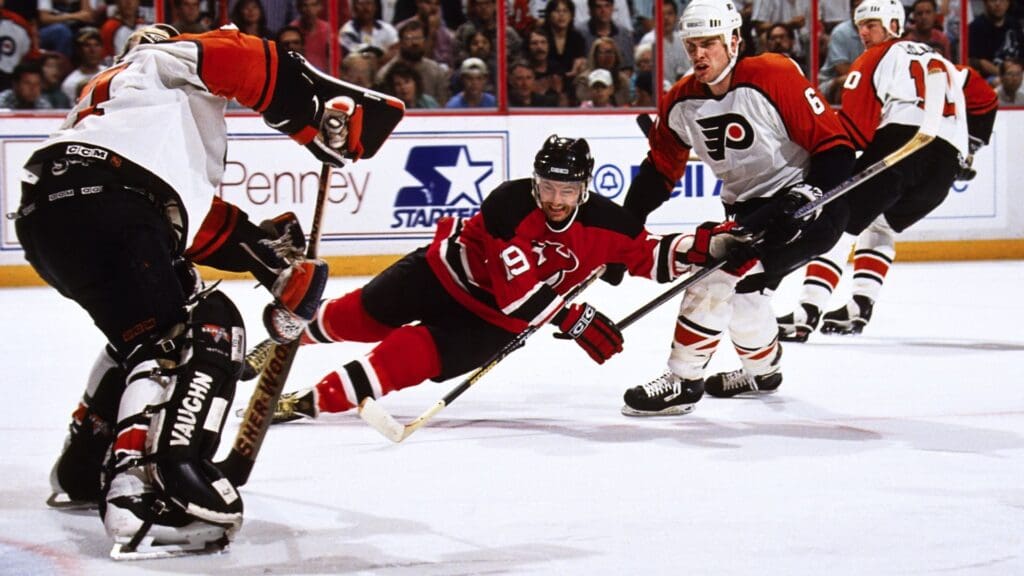 Unknown Date, 1995; Philadelphia, PA, USA; FILE PHOTO; New Jersey Devils left wing Bob Carpenter (19) in action against the Philadelphia Flyers goalie Ron Hextall (27) and defensemen Chris Therien (6) at the Spectrum.